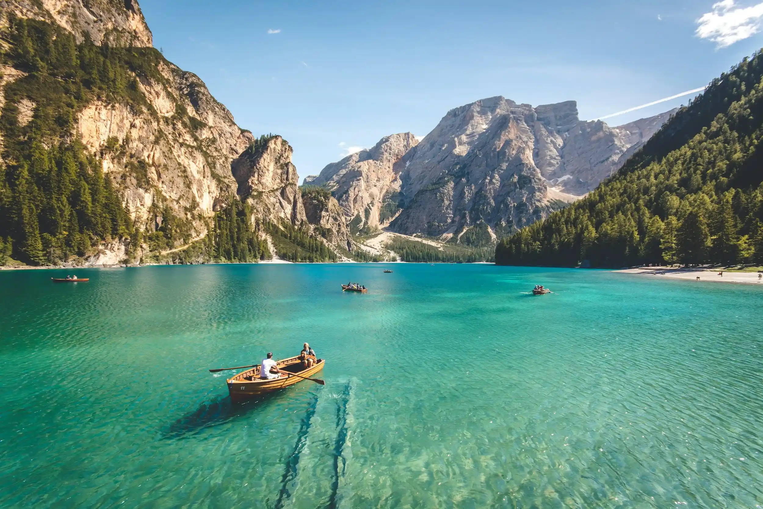 Stunning view of Pragser Wildsee lake in the Dolomites, representing travel stories.